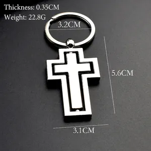 Porte-clés croix en métal rotatif avec finition argentée et dimensions détaillées