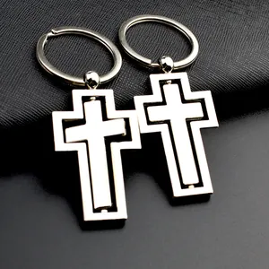 Lot de deux porte-clés croix rotative en métal argenté avec une finition polie miroir