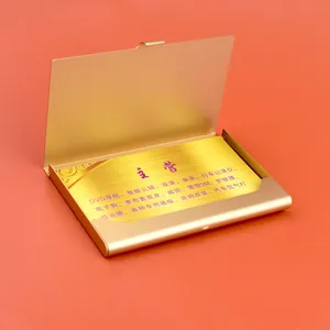 Slim golden aluminum business card holder with matte finish shown from a side-top view