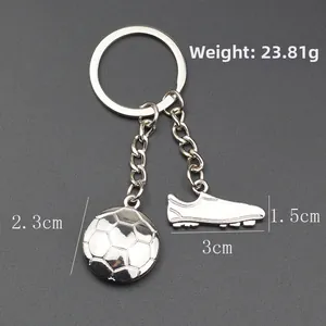 Metal soccer ball and cleat keychain charm souvenir with polished silver finish