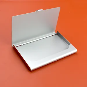 Detailed view of matte silver aluminum business card holder with flip-top opening