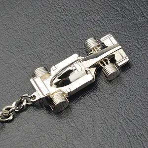 Sleek silver metal F1 racing car keychain with a polished mirror finish on black leather