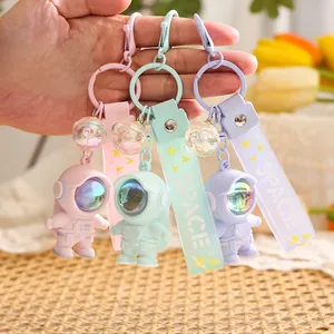 Luminous astronaut keychain set in macaron pink green and purple with SPACE strap