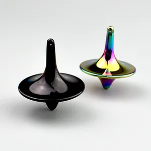 Detailed view of metal stress relief spinners in polished black and rainbow finishes