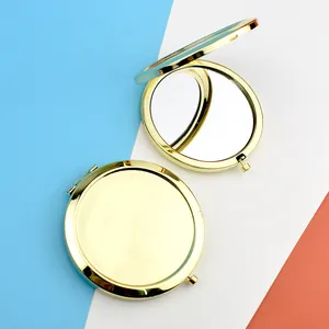Detail of rose gold metal folding pocket mirrors with double-sided mirror design