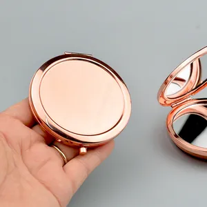 Portable rose gold metal folding makeup mirror with compact round dual-sided glass surface