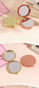 Detail of compact round folding 304 stainless steel mirror in gold and rose gold