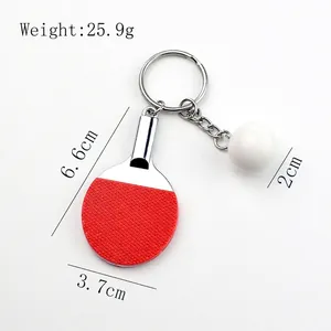Miniature table tennis racket and ball keychain with dimensions and weight detail