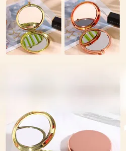 Detail of round folding travel makeup mirror in polished gold and rose gold finishes
