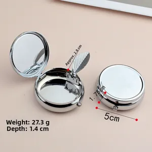Detail view of mini metal portable round storage box with interior mirror and dimensions