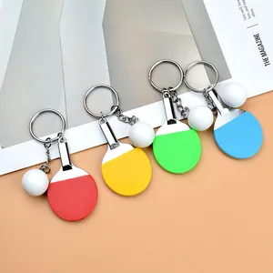 Ping pong racket keychains in red, yellow, green, and blue with metal rings