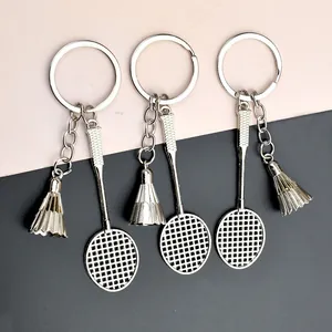 Set of creative silver metal badminton racket and birdie keychains for sports fans