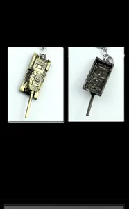 Macro detail showing front and back views of the vintage metal tank model keychain
