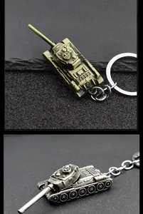 Detail of metal tank keychain in antique bronze and silver finish showing military armor textures