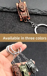 Three variants of vintage tank metal keychains in bronze, copper, and silver grey finishes