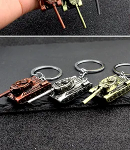 Close-up of vintage metal tank keychains in bronze, silver, and copper finishes