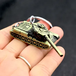 Creative metal tank model keychain with antique bronze finish on black background