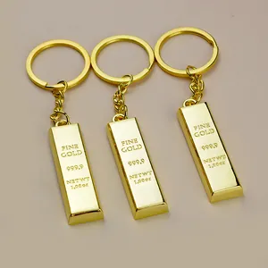 Three simulation gold bar keychains with fine gold engraving on polished metal finish