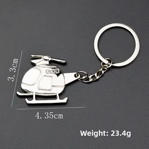 Polished silver metal helicopter keychain with dimensions 3.3cm x 4.35cm and 23.4g weight