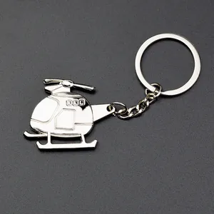 Polished silver metal helicopter model keychain with realistic 000 engraved details