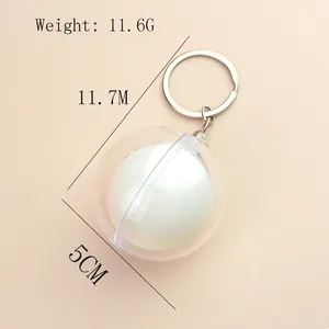 Mini table tennis keychain with dimensions showing 11.7cm length and 5cm diameter sphere