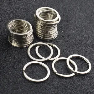 Macro shot of 32mm silver flat metal split rings for keychains on black background