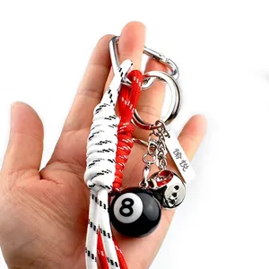 Porte-clés avec boule n°8 noire, dé en métal et cordon tressé en paracorde de qualité