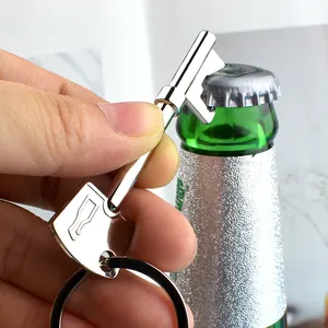 Polished silver key-shaped bottle opener keychain shown on a green glass bottle