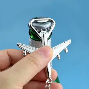 Creative airplane shaped zinc alloy bottle opener keychain with a polished silver finish