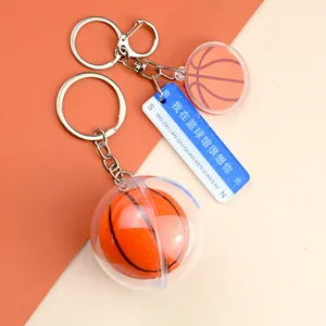 Detailed view of acrylic basketball keychain with 3D ball model and decorative blue charm