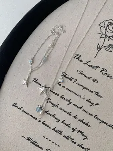 Detail view of S925 silver jewelry set featuring starfish pendants and pearls