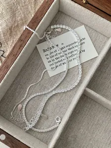 Macro detail of S925 sterling silver tennis chain with sparkling cubic zirconia stones
