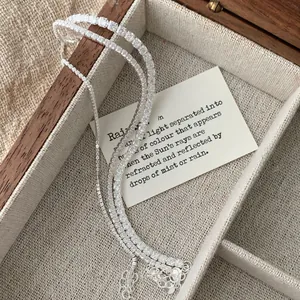 Three elegant S925 sterling silver tennis bracelets with cubic zirconia on a jewelry box