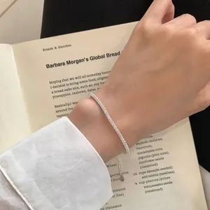 Elegant S925 sterling silver tennis bracelet with sparkling zircons worn by a model
