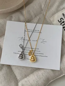 Detailed macro view of S925 sterling silver gourd necklaces in gold and silver finish
