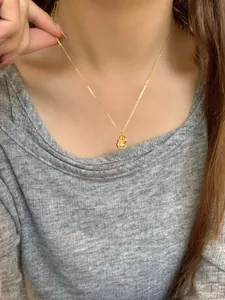 Close-up of S925 silver gourd pendant necklace worn on a model's collarbone