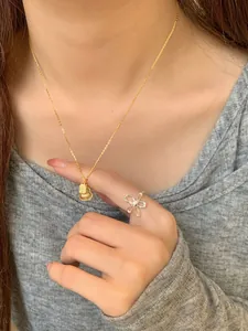 S925 sterling silver gourd necklace and hollow flower ring set worn by a model