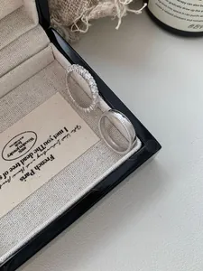 Close-up of S925 sterling silver eternity ring set with sparkling zircon stones