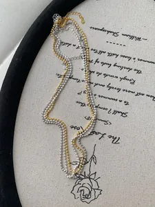 Detail of gold and silver S925 sterling silver bead chains with lobster clasps