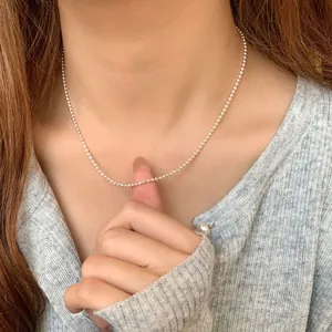 Elegant S925 sterling silver beaded ball chain necklace worn by a female model