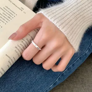 Minimalist S925 sterling silver hammered texture ring worn for a refined aesthetic style