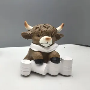Detailed resin highland cow sculpture showing realistic long hair texture and cute design