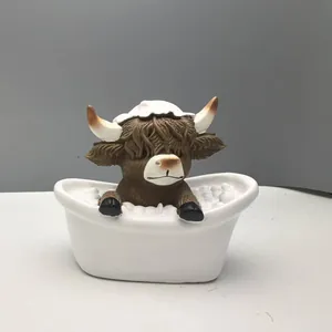Detail of Highland Cow figurine in a white bathtub resin ornament with realistic fur texture