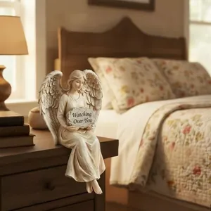 Guardian Angel Shelf Sitter statue with wings and Watching Over You message on nightstand