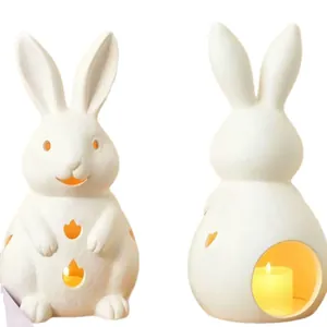 White ceramic bunny candle holder set with decorative cutouts for Easter home decor