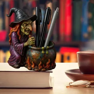 Witch cauldron pen holder with purple wizard figurine and flame base desktop organizer