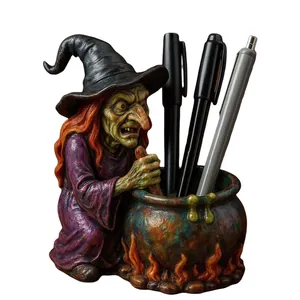 Detailed witch cauldron pen holder statue with classic green-faced witch and purple robe