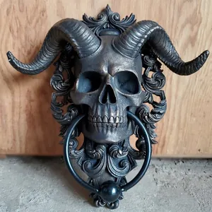 Macro view of gothic goat skull door knocker with ornate bronze finish and metal ring