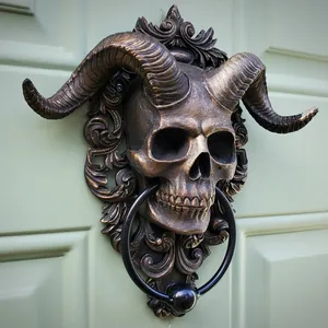 Detail of vintage bronze ram skull door knocker with intricate textures and metal ring