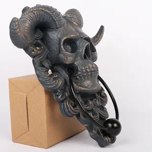 Gothic resin sheep skull wall plaque with ram horns and metal ring knocker in dark grey